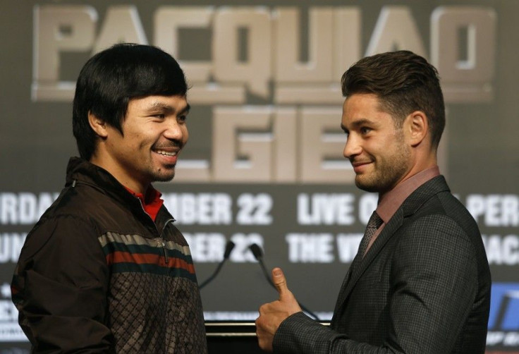 Manny Pacquiao (L) from the Philippines and Chris Algieri of the U.S. react as they pose during a news conference at Venetian Macao in Macau August 25, 2014. Pacquiao will defend his WBO welterweight title against Algieri at the Venetian's Cotai Arena in 