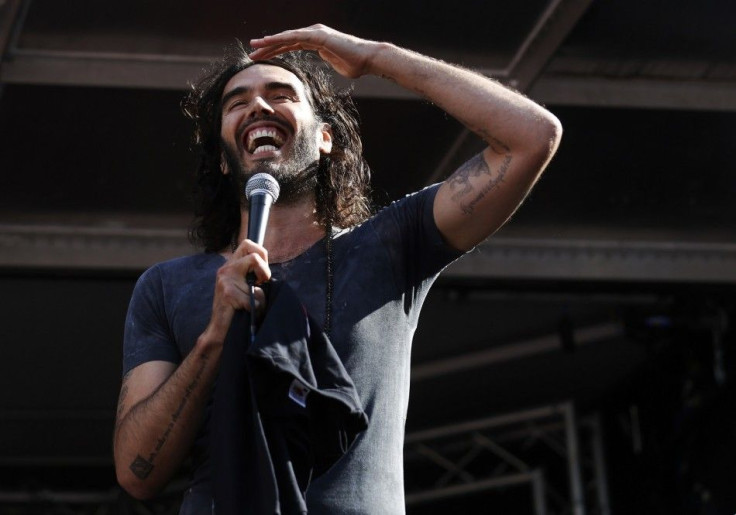 Comedian and presenter Russell Brand speaks during an anti-austerity rally in Parliament Square in London June 21, 2014.