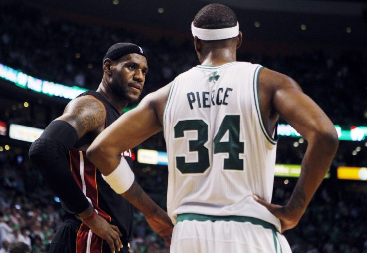 Miami Heat forward LeBron James (L) and Boston Celtics forward Paul Pierce talk during the second quarter of their NBA basketball game in Boston, Massachusetts October 26, 2010.