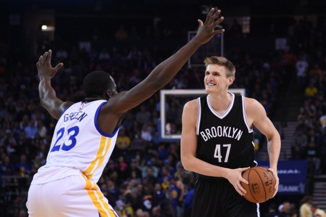 November 13, 2014; Oakland, CA, USA; Brooklyn Nets forward Andrei Kirilenko (47) controls the basketball against Golden State Warriors forward Draymond Green (23) during the first quarter at Oracle Arena.
