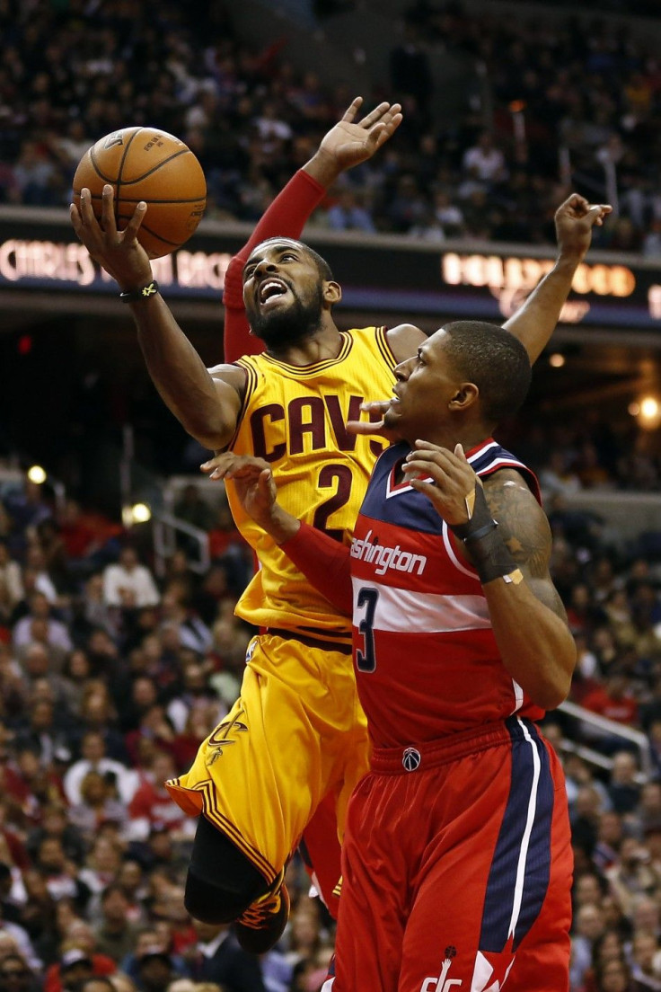 Nov 21, 2014; Washington, DC, USA; Cleveland Cavaliers guard Kyrie Irving (2) shoots the ball over Washington Wizards guard Bradley Beal (3) in the third quarter at Verizon Center. The Wizards won 91-78.