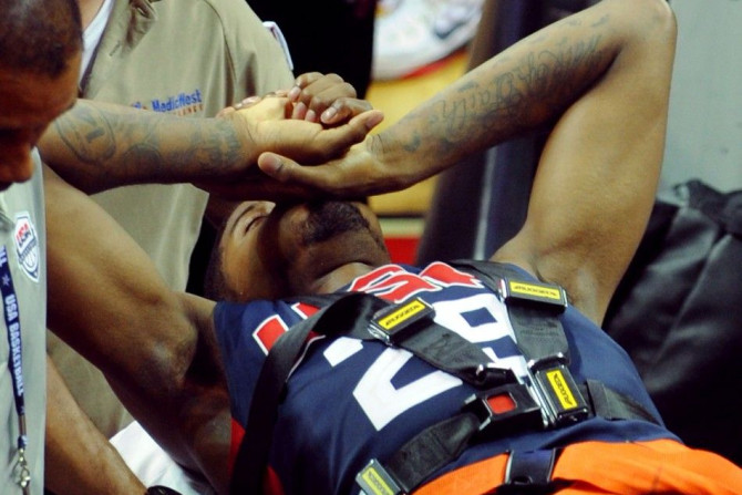 Aug 1, 2014; Las Vegas, NV, USA; Team USA guard Paul George is carted off the floor on a gurney after suffering a lower leg injury during the USA Basketball Showcase at Thomas & Mack Center.