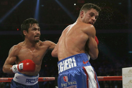 Manny Pacquiao (L) of the Philippines punches Chris Algieri of the U.S. during their World Boxing Organisation (WBO) 12-round welterweight title fight at the Venetian Macao hotel in Macau November 23, 2014.