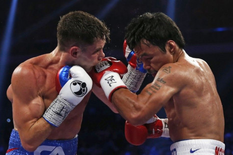 Manny Pacquiao (R) of the Philippines punches Chris Algieri of the U.S. during their World Boxing Organisation (WBO) 12-round welterweight title fight at the Venetian Macao hotel in Macau November 23, 2014.