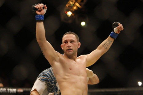 Frankie Edgar of the U.S. celebrates his victory after his bout against compatriot Bj Penn in the Ultimate Fighting Championship tournament in Abu Dhabi April 10, 2010.