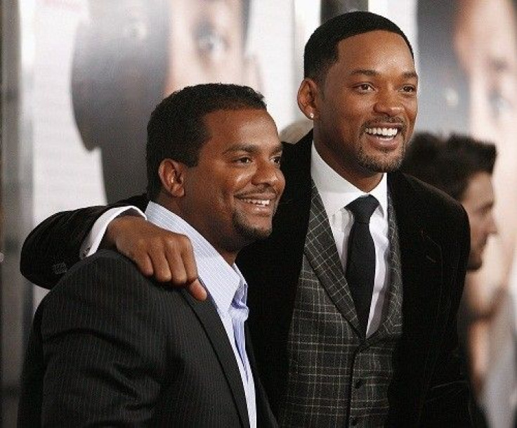 Cast members Will Smith (R) poses with actor Alfonso Ribeiro at the premiere of the movie &quot;Seven Pounds&quot; at the Mann Village theatre in Westwood, California December 16, 2008. The movie opens in the U.S. on December 19.