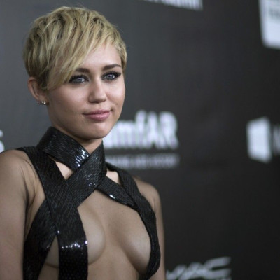 Singer Miley Cyrus poses at the amfAR's Fifth Annual Inspiration Gala