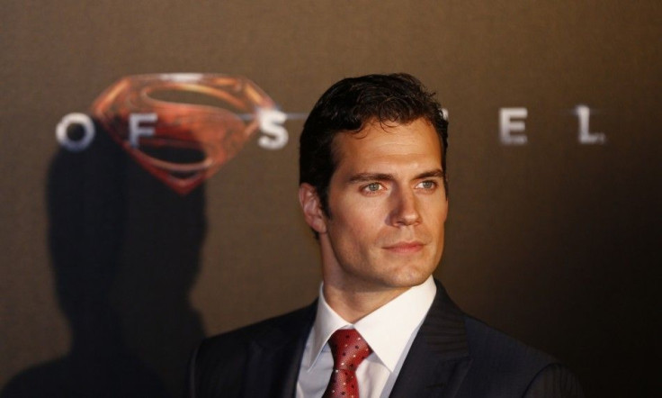 Cast member Henry Cavill poses for pictures after his arrival to the Australian premiere of "Man of Steel"