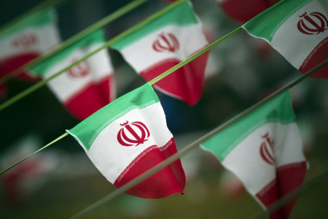 Iran&#039;s national flags are seen on a square in Tehran