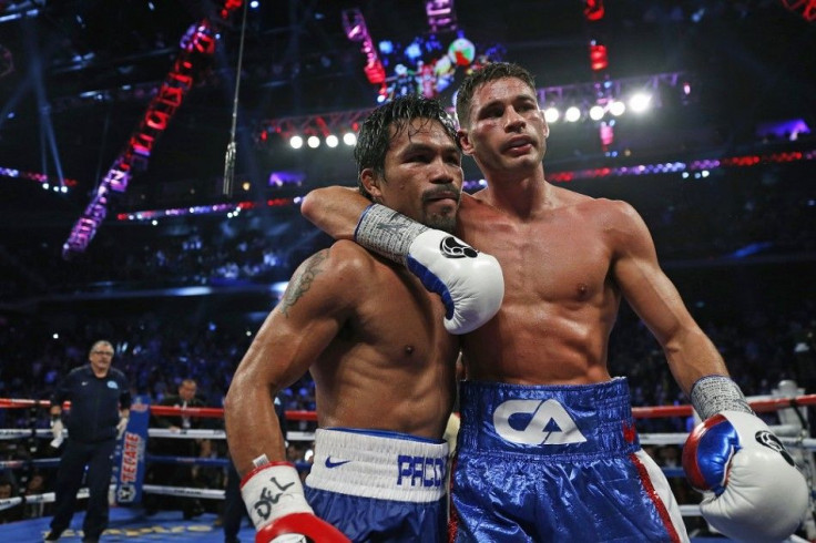 Manny Pacquiao (L) of the Philippines poses with Chris Algieri of the U.S. after winning their World Boxing Organisation (WBO) 12-round welterweight title fight at the Venetian Macao hotel in Macau November 23, 2014.