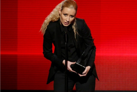 Iggy Azalea accepts the award for favorite rap/hip-hop artist during the 42nd American Music Awards in Los Angeles