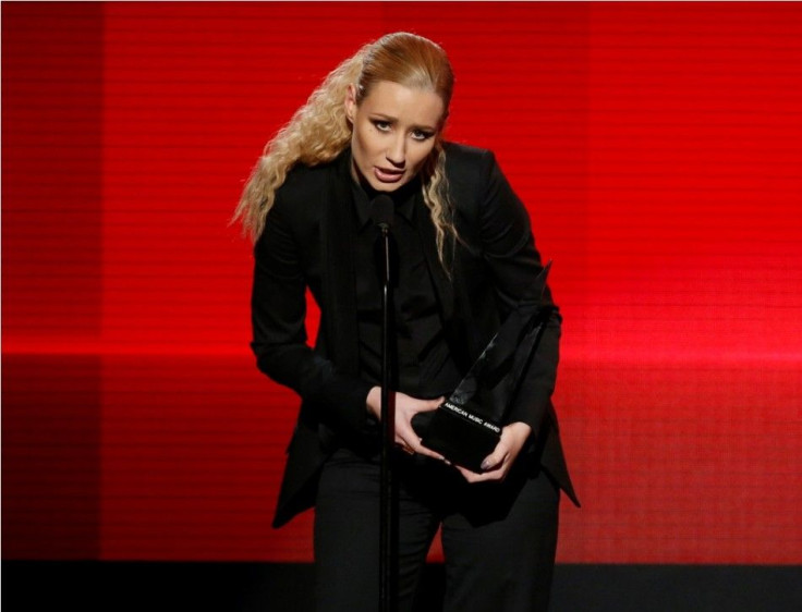 Iggy Azalea accepts the award for favorite rap/hip-hop artist during the 42nd American Music Awards in Los Angeles