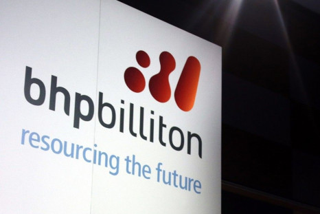 A promotional sign adorns a stage at a BHP Billiton function in central Sydney August 20, 2013. Australian shares edged 0.1 percent higher on Wednesday morning, as a mixed bag of earnings kept buyers in check with top miner BHP Billiton Ltd sliding after 