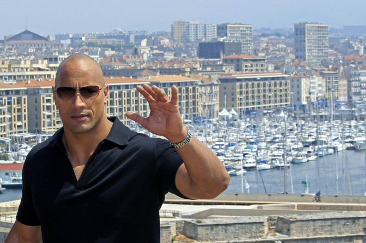 Cast member Dwayne Johnson poses during a photocall at the premiere of the film &quot;Fast and Furious 5&quot;