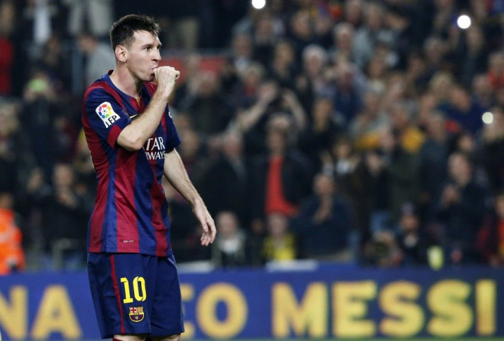 Barcelona's Lionel Messi celebrates his second goal during the Spanish first division soccer match against Sevilla at Nou Camp stadium in Barcelona November 22, 2014. Messi set a La Liga scoring record of 253 goals when he netted a hat-trick in Satur