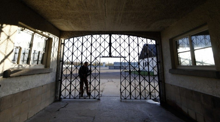 A journalist films the main gate of the former concentration camp in Dachau near Munich where the door with the Nazi slogan &quot;Arbeit macht frei&quot; (Work sets you free) has been stolen November 3, 2014.