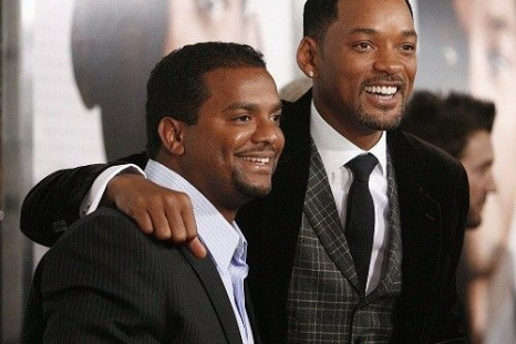 Cast members Will Smith (R) poses with actor Alfonso Ribeiro at the premiere of the movie "Seven Pounds" at the Mann Village theatre in Westwood, California December 16, 2008. The movie opens in the U.S. on December 19.