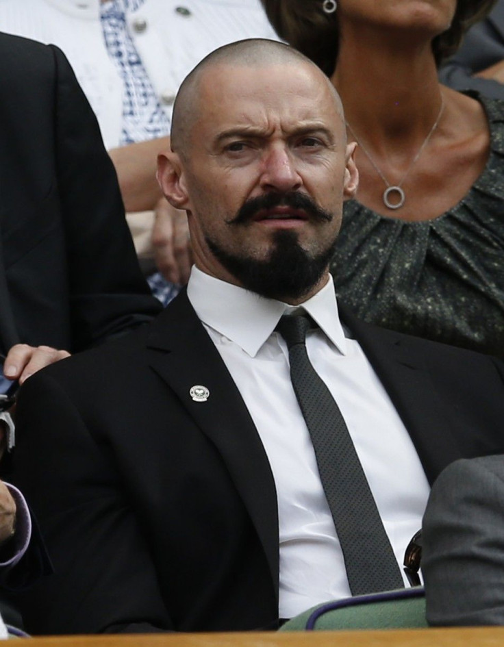 Actor Hugh Jackman sits on Centre Court at the Wimbledon Tennis Championships