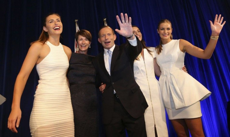 Australia's conservative leader Tony Abbott (C) stands with his wife Margaret (2nd L) and daughters (L-R) Frances, Louise and Bridget as he claims victory in Australia's federal election during an election night function in Sydney September 7, 2013. Abbot