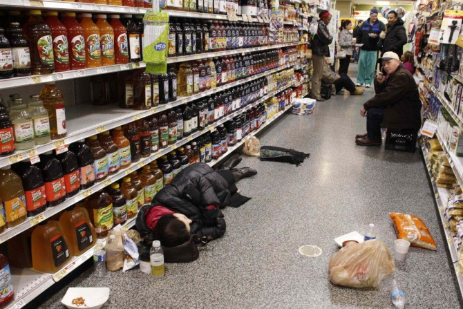 People hang out in a Publix grocery store after being stranded due to a snow storm in Atlanta, Georgia, in this January 29, 2014 file photo.   Atlanta is usually known for its mild winters but when an ice storm began hitting the Metro area directly, traff