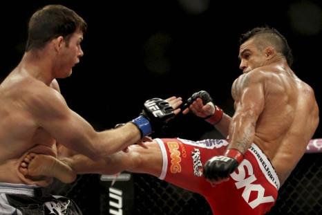Vitor Belfort (R) of Brazil fights Michael Bisping of Britain during the Ultimate Fighting Championship (UFC), a professional mixed martial arts (MMA) competition, in Sao Paulo January 20, 2013.