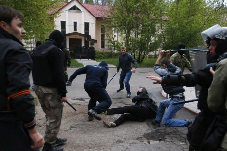 Pro-Russian Protesters Attack A Pro-Ukranian Protester During A Pro-Ukrainian Rally In The Eastern City Of Donetsk