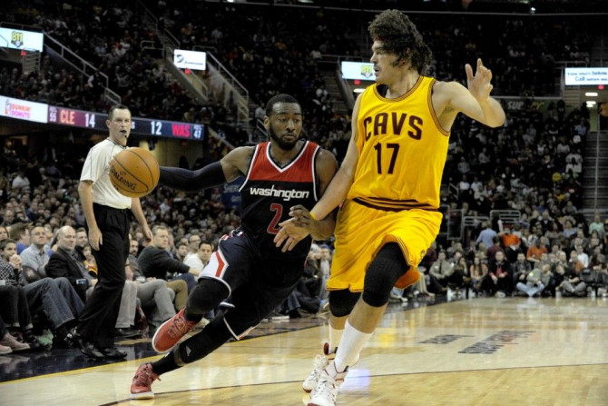 Nov 26, 2014; Cleveland, OH, USA; Washington Wizards guard John Wall (2) drives on Cleveland Cavaliers center Anderson Varejao (17) during the second quarter at Quicken Loans Arena. The Cavaliers beat the Wizards 113-87.