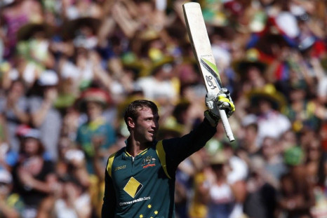 Australia&#039;s Phil Hughes celebrates reaching his century during the one-day international cricket match against Sri Lanka at the Melbourne Cricket Ground January 11, 2013.
