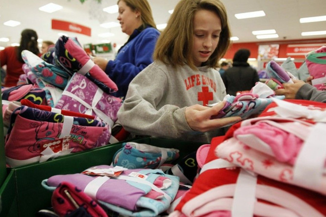 Shoppers look through a bin full of pajamas inside a Target store on the shopping day dubbed &quot;Black Friday&quot; in Torrington, Connecticut November 25, 2011. The U.S. holiday shopping season was in full-swing on Thursday, with retailers hoping consu