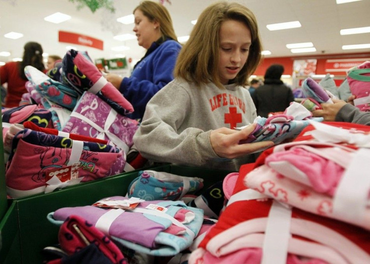 Shoppers look through a bin full of pajamas inside a Target store on the shopping day dubbed "Black Friday" in Torrington, Connecticut November 25, 2011. The U.S. holiday shopping season was in full-swing on Thursday, with retailers hoping consu