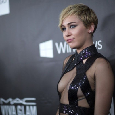 Singer Miley Cyrus poses at the amfAR's Fifth Annual Inspiration Gala in Los Angeles, California