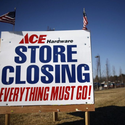 Signs advertising a store closing and sales are seen for the Ace hardware store  in Islip, New York January 29, 2009.  The number of Americans claiming jobless benefits hit a record high in mid-January, while orders for long-lasting factory goods fell for