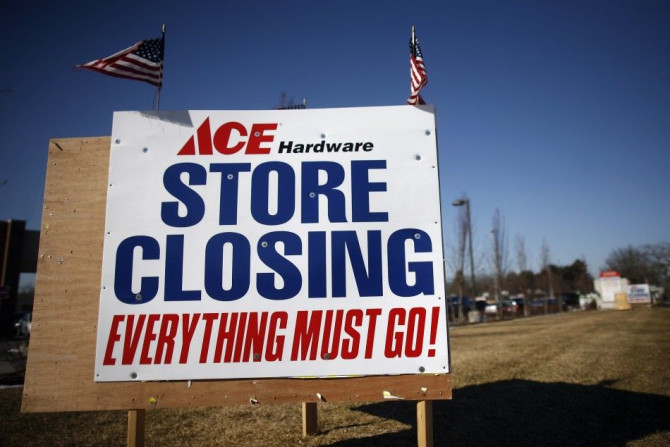 Signs advertising a store closing and sales are seen for the Ace hardware store  in Islip, New York January 29, 2009.  The number of Americans claiming jobless benefits hit a record high in mid-January, while orders for long-lasting factory goods fell for
