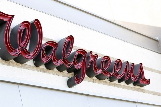 The sign of a Walgreens store is pictured in Pasadena, California December 20, 2013. Walgreen Co reported higher quarterly sales on Friday, but an increase in promotions and a slowdown in the introduction of higher-profit generic drugs cut into its gross 