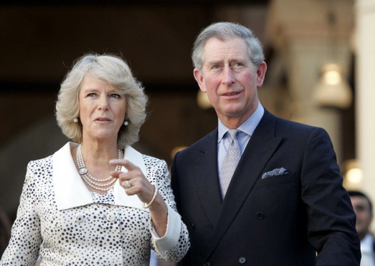 Britain&#039;s Prince Charles of Wales (R) and his wife Camilla, the Duchess of Cornwall, gesture at the Al-Azhar park in Cairo March 20, 2006.