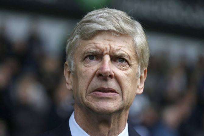 Arsenal manager Arsene Wenger reacts before their English Premier League soccer match against West Bromwich Albion at The Hawthorns in West Bromwich, central England November 29, 2014.