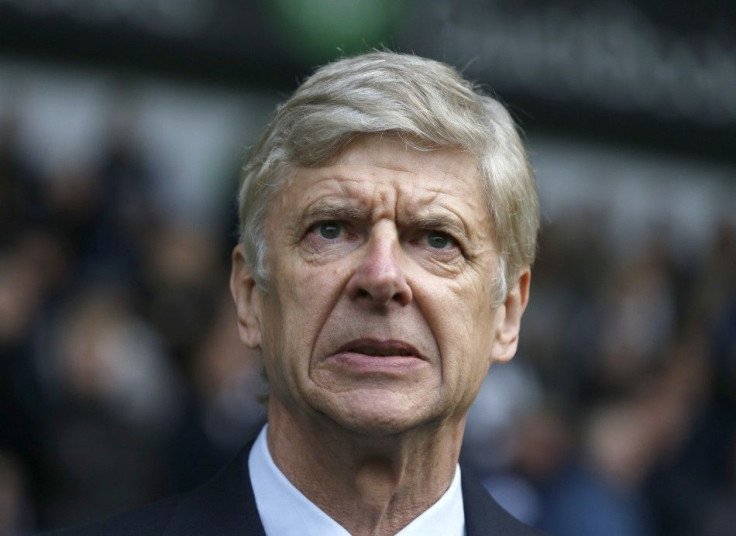Arsenal manager Arsene Wenger reacts before their English Premier League soccer match against West Bromwich Albion at The Hawthorns in West Bromwich, central England November 29, 2014.