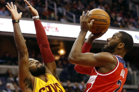 Kyrie Irving guarding John Wall