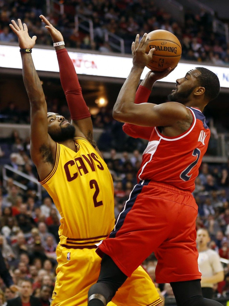 Kyrie Irving guarding John Wall