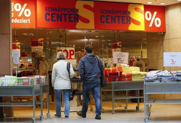 Shoppers walk in a Karstadt hot deal department store in Frankfurt/Oder October 24, 2014. Struggling German department store chain Karstadt is aiming for an operating profit margin of between 2.5 and 3 percent in 2017, its new chief executive was quoted s