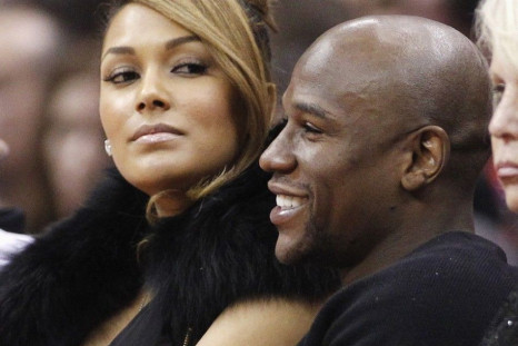 U.S. boxer Floyd Mayweather Jr. (R) sits with Shantel Jackson (L) courtside at the NBA basketball game between the Chicago Bulls and Los Angeles Clippers in Los Angeles December 30, 2011.