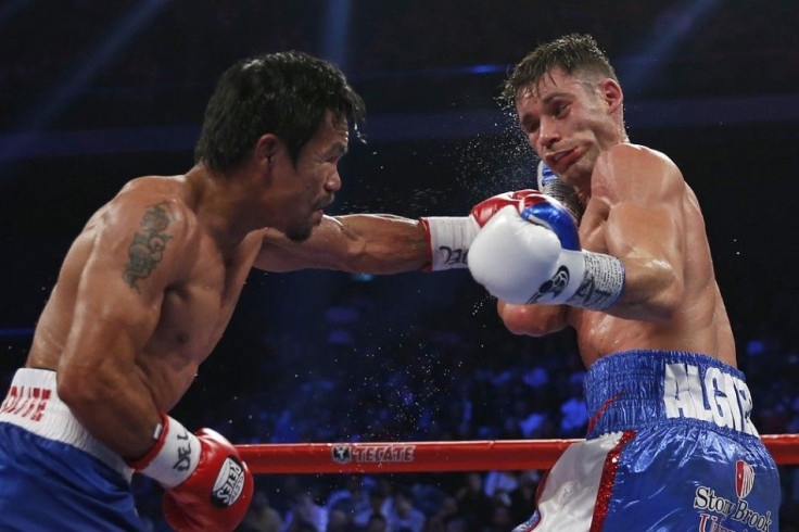 Manny Pacquiao (L) of the Philippines punches Chris Algieri of the U.S. during their World Boxing Organisation (WBO) 12-round welterweight title fight at the Venetian Macao hotel in Macau November 23, 2014.