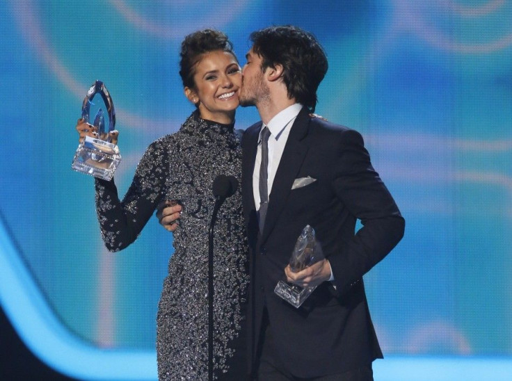 Nina Dobrev and Ian Somerhalder accept the award for favorite on-screen chemistry for their show &quot;The Vampire Diaries&quot; at the 2014 People's Choice Awards in Los Angeles, California January 8, 2014.