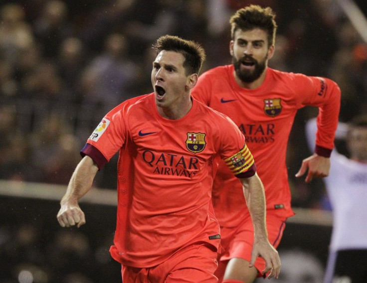 Barcelona's Lionel Messi (L) and Gerard Pique celebrate after their team scored a goal against Valencia during their Spanish first division soccer match at the Mestalla stadium in Valencia November 30, 2014.