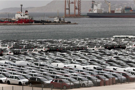 Vehicles are parked at a cargo terminal at Piraeus port, near Athens