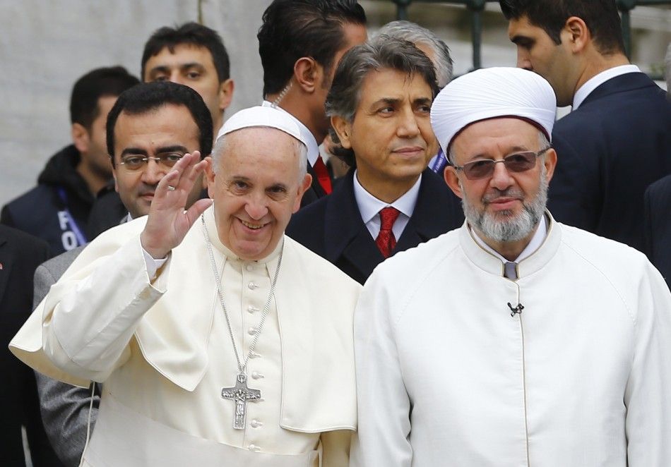 Pope Francis is welcomed by Mufti of Istanbul, Rahmi Yaran R outside Sultan Ahmet mosque, popularly known as the Blue Mosque in Istanbul November 29, 2014. Pope Francis began a visit to Turkey on Friday with the delicate mission of strengthening ties wi