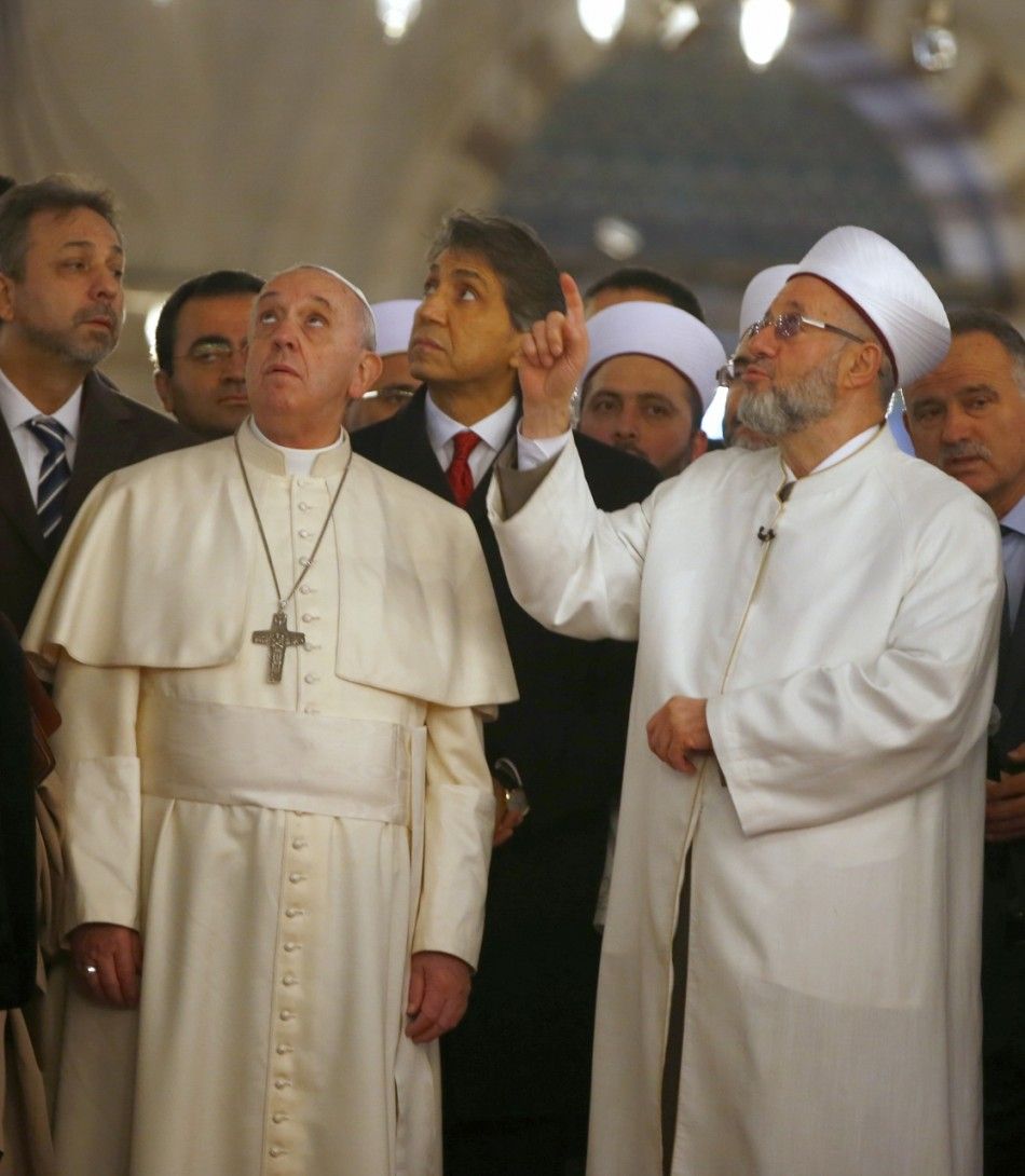 Pope Francis listens to Rahmi Yaran, Mufti of Istanbul R during a visit to Sultan Ahmet mosque, popularly known as the Blue Mosque  in Istanbul November 29, 2014. Pope Francis began a visit to Turkey on Friday with the delicate mission of strengthening 