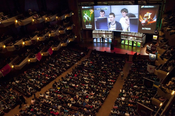 A packed Benaroya Hall watches &quot;Natus Vincere,&quot; pictured on the screen, battle &quot;The Alliance&quot; during &quot;The International&quot; Dota 2 video game competition in Seattle, Washington August 11, 2013. Sixteen teams from 12 countries ba