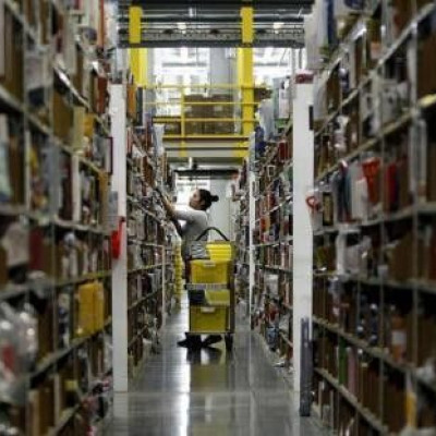 Amazon Worker Prepares Items for Cyber Monday