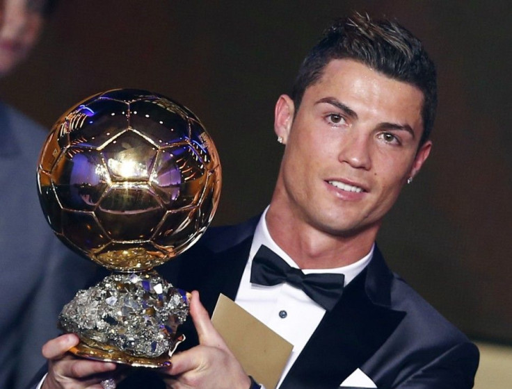 Portugal&#039;s Cristiano Ronaldo holds his trophy after being awarded the FIFA Ballon d&#039;Or 2013